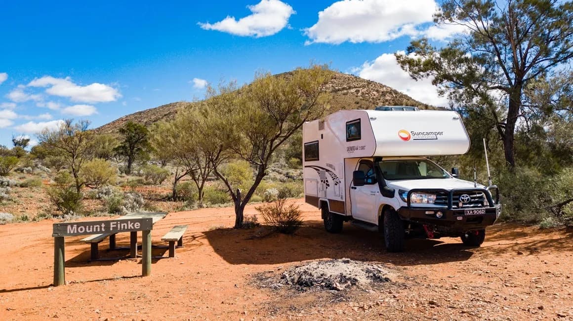 Sherwood 4x4 at Googs Track with Mount Finke red rocky hill as backdrop