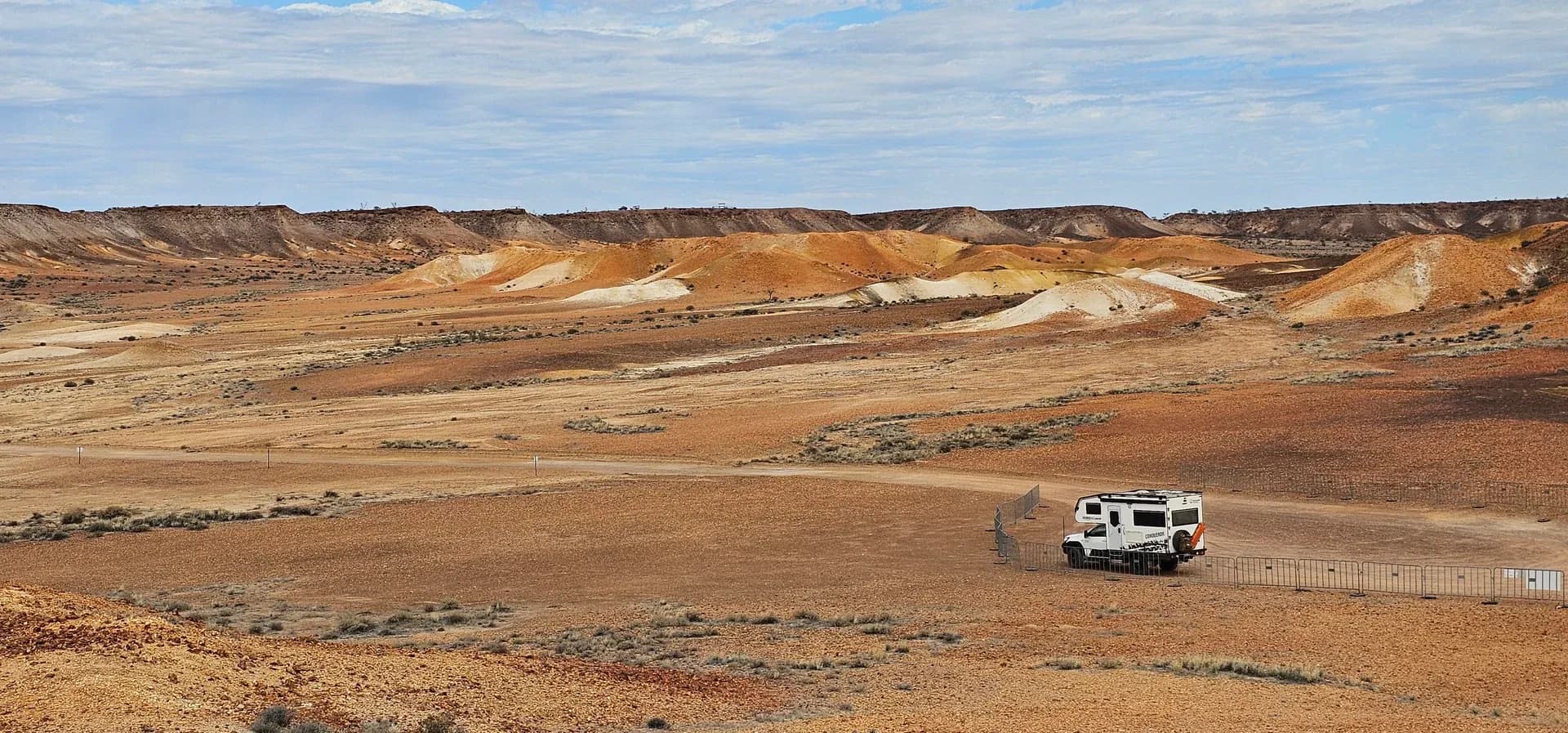 Suncamper overlooking the coloured hills of Kanku-Breakaways Conservation Park, South Australia