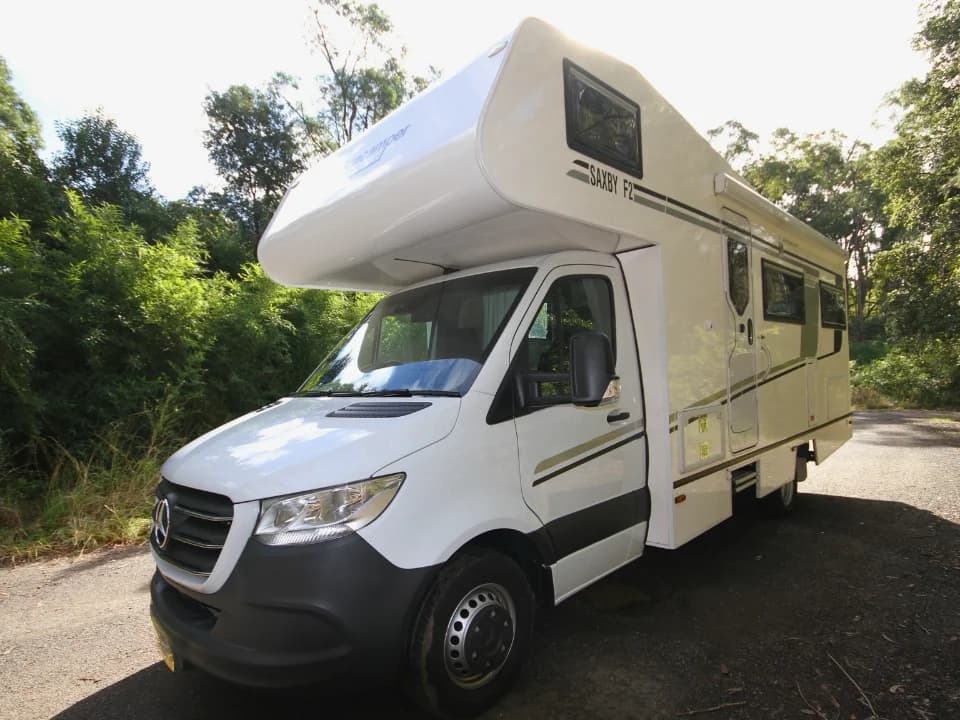 Suncamper Saxby F-2 front-quarter exterior on bush road — exterior