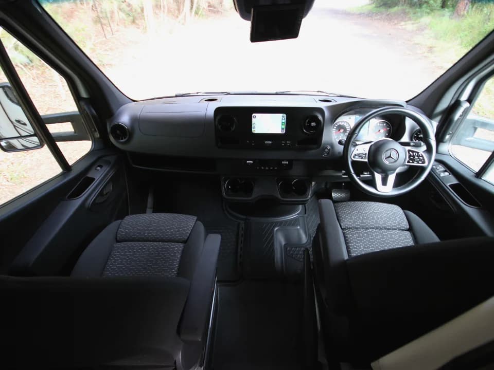 Suncamper Saxby F-2 cab cockpit with Mercedes-Benz dashboard — cab