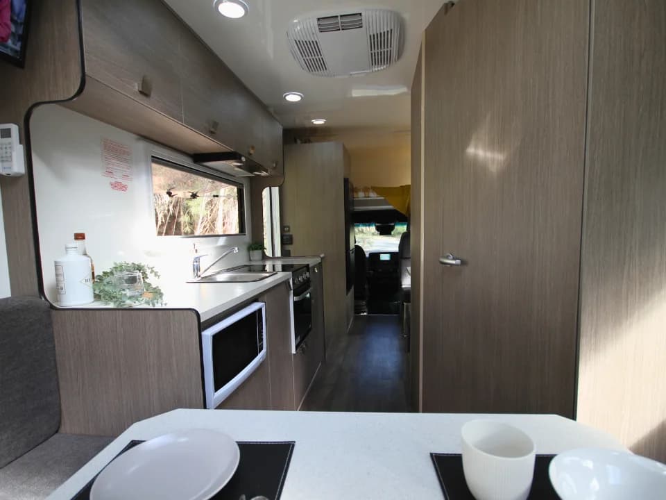 Suncamper Saxby F-2 kitchen galley looking toward cab — kitchen