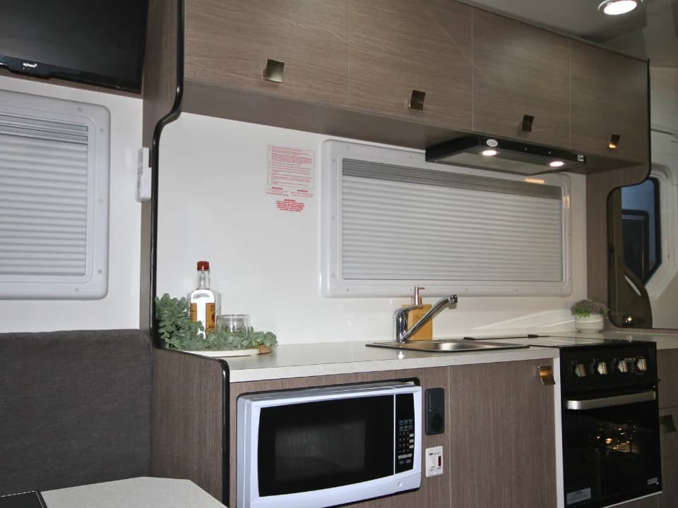 Suncamper Saxby F-2 kitchen bench and appliances — kitchen
