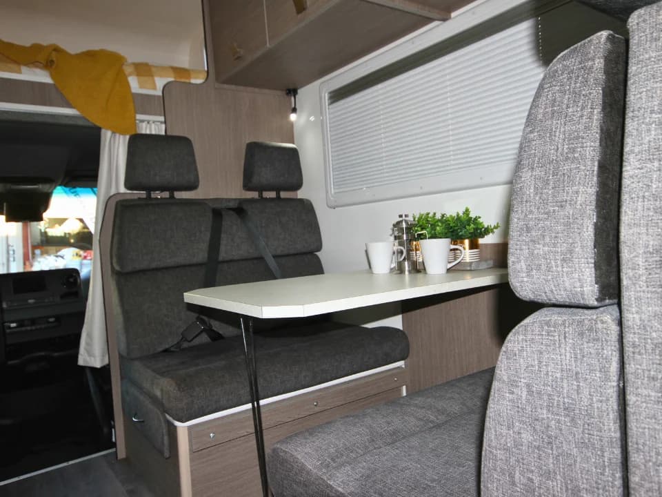 Suncamper Saxby F-2 travel seats and fold-down table — interior