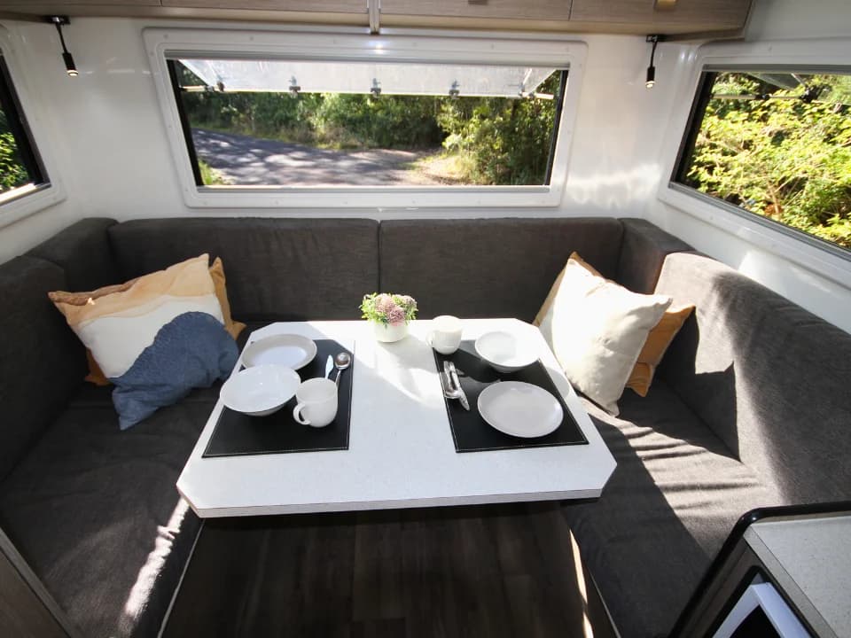 Suncamper Saxby F-2 U-lounge dinette from above — interior