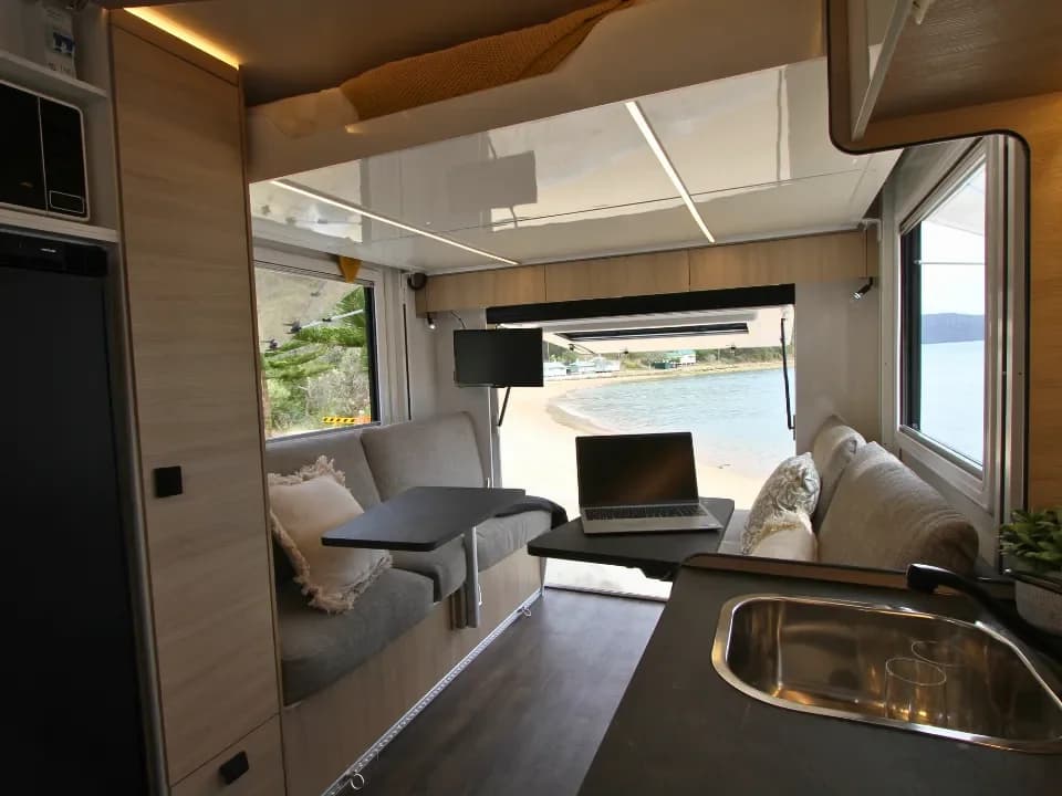 Suncamper Saxby S-2 seating area with rear tailgate — interior