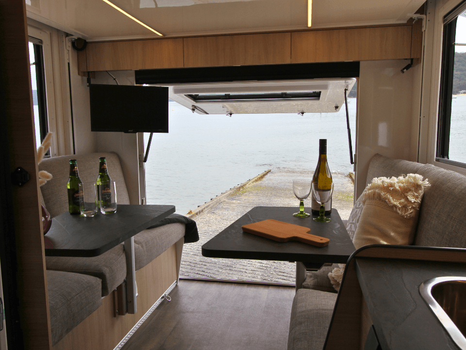 Suncamper Saxby S-2 seating with rear tailgate — interior