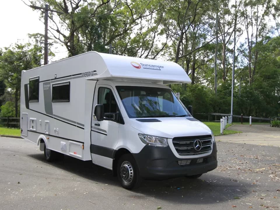Suncamper Sovereign Q-2 drivers side front quarter — exterior