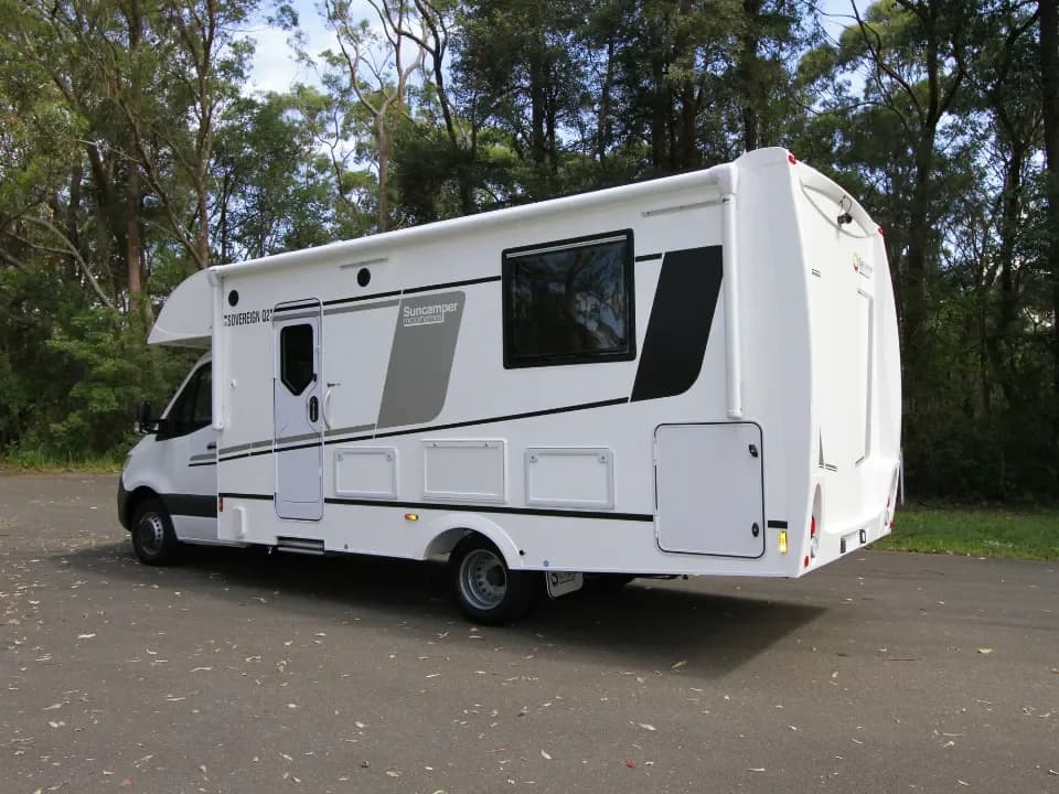 Suncamper Sovereign Q-2 passenger side rear quarter — exterior