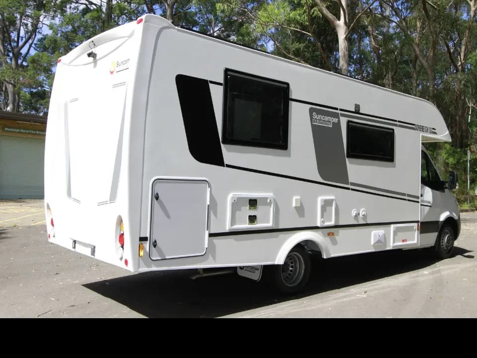 Suncamper Sovereign Q-2 rear drivers quarter — exterior