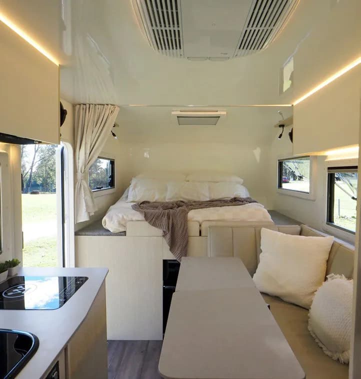 Inside the Conqueror 3.0, looking towards the bed and lounge